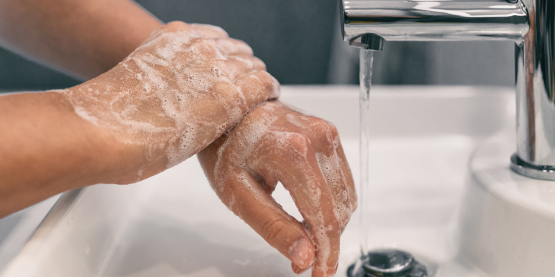Soapy hands at a sink